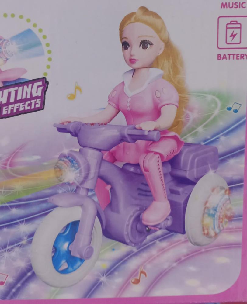 Girl doll on a disco bicycle