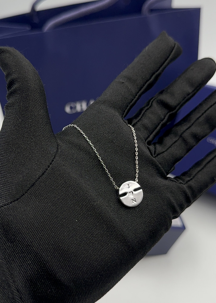 Small silver Chaumet circular pendant