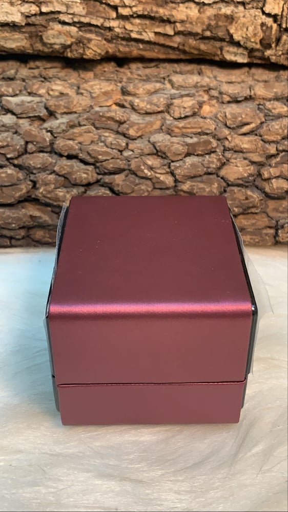 Velvet ring box from the inside contains internal lighting red color