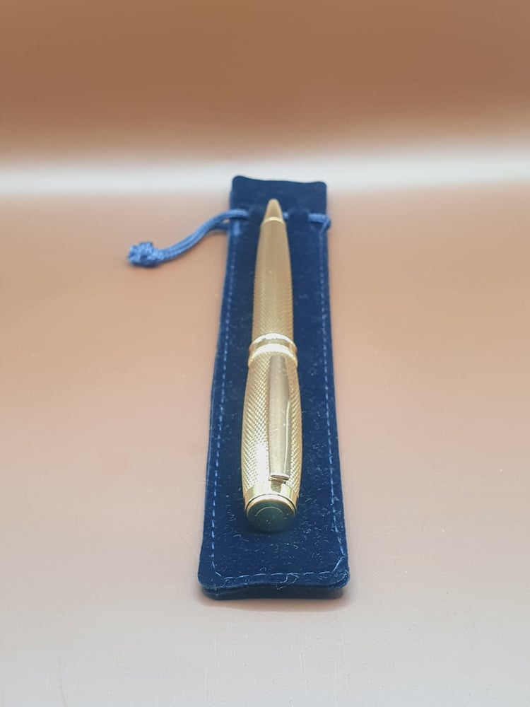 قلم ماركه RADO لون دهبي لماع