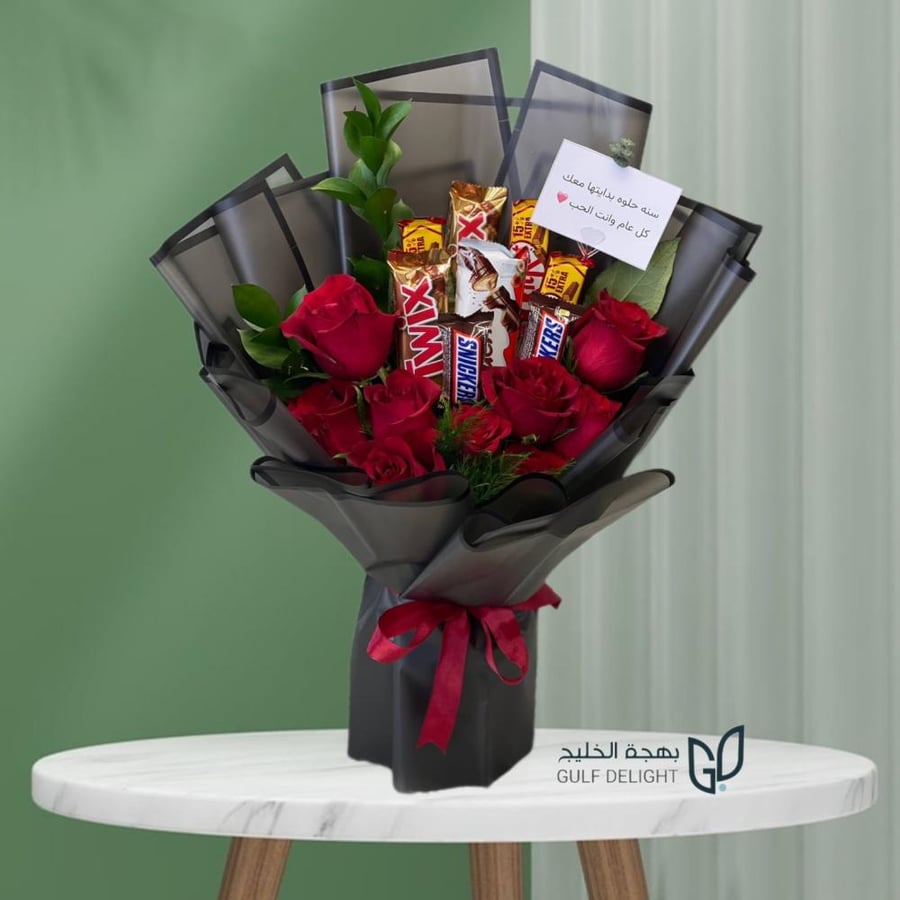 A bouquet of flowers and assorted chocolates