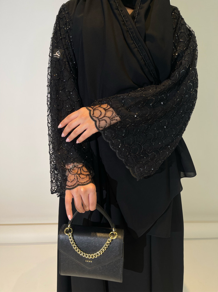 The fabric is royal crepe - tulle with beads and sequins
