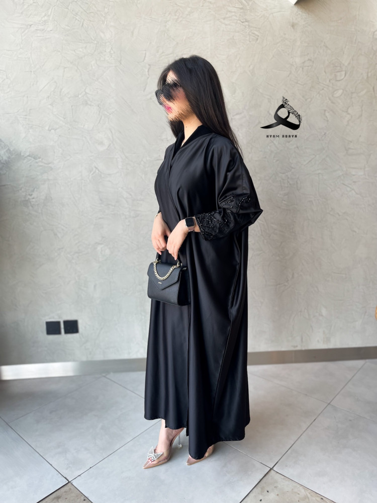 The fabric is light summer, a half thawb design