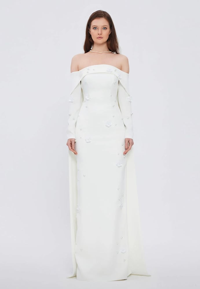 White cape dress with a design
