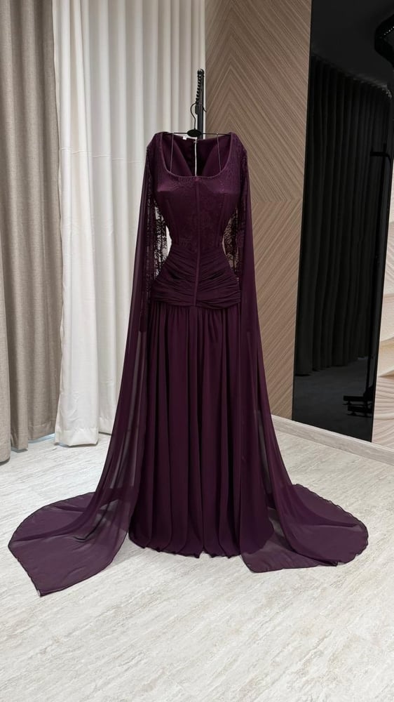 A deep lilac evening dress with a luxurious royal design