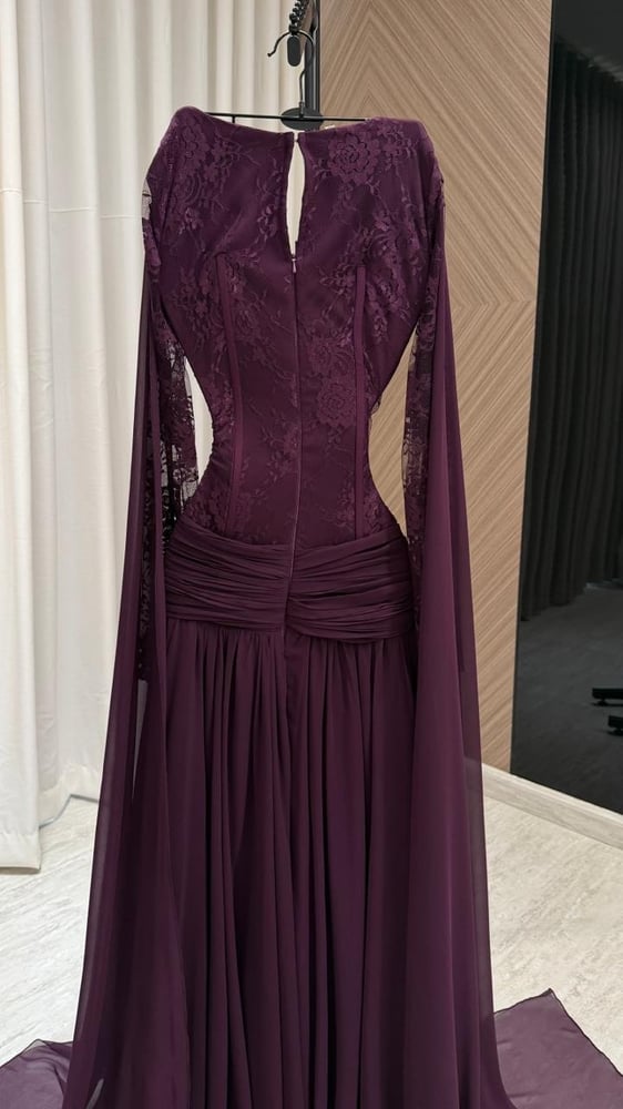A deep lilac evening dress with a luxurious royal design