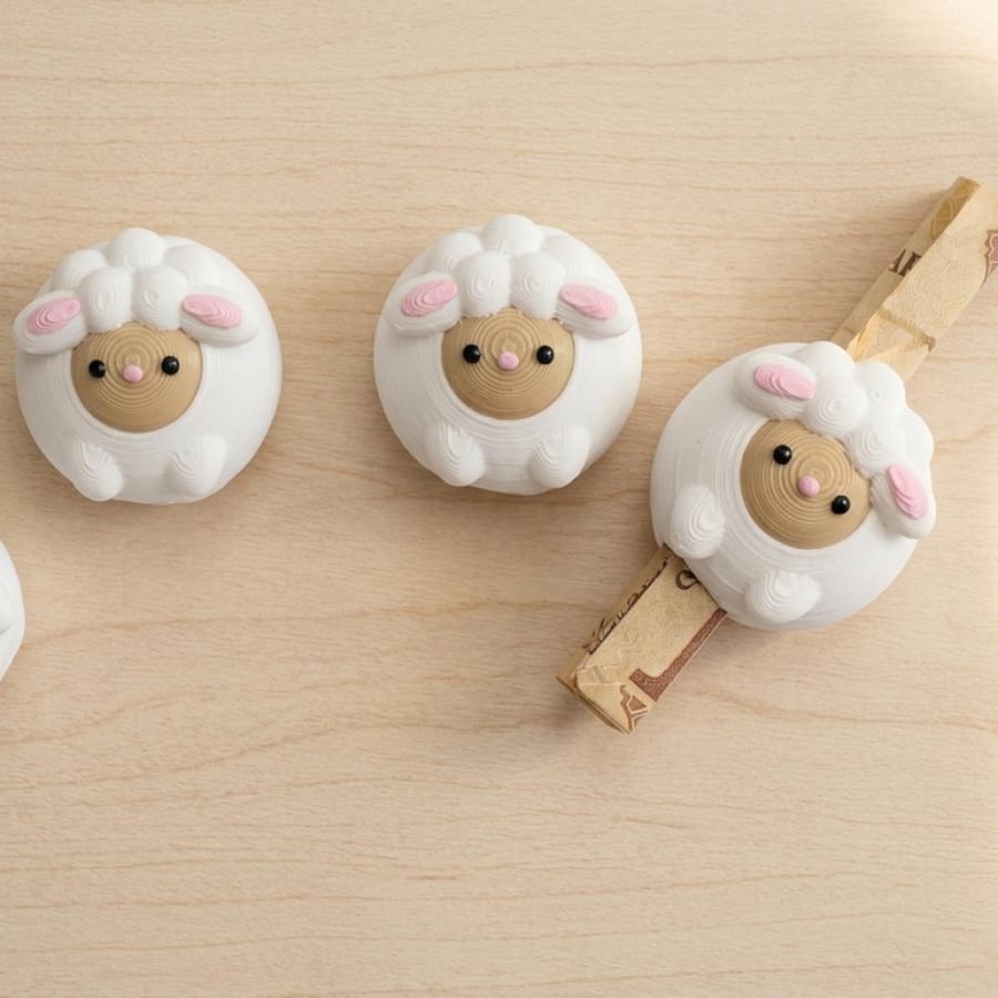 Money holder in the shape of a sheep
