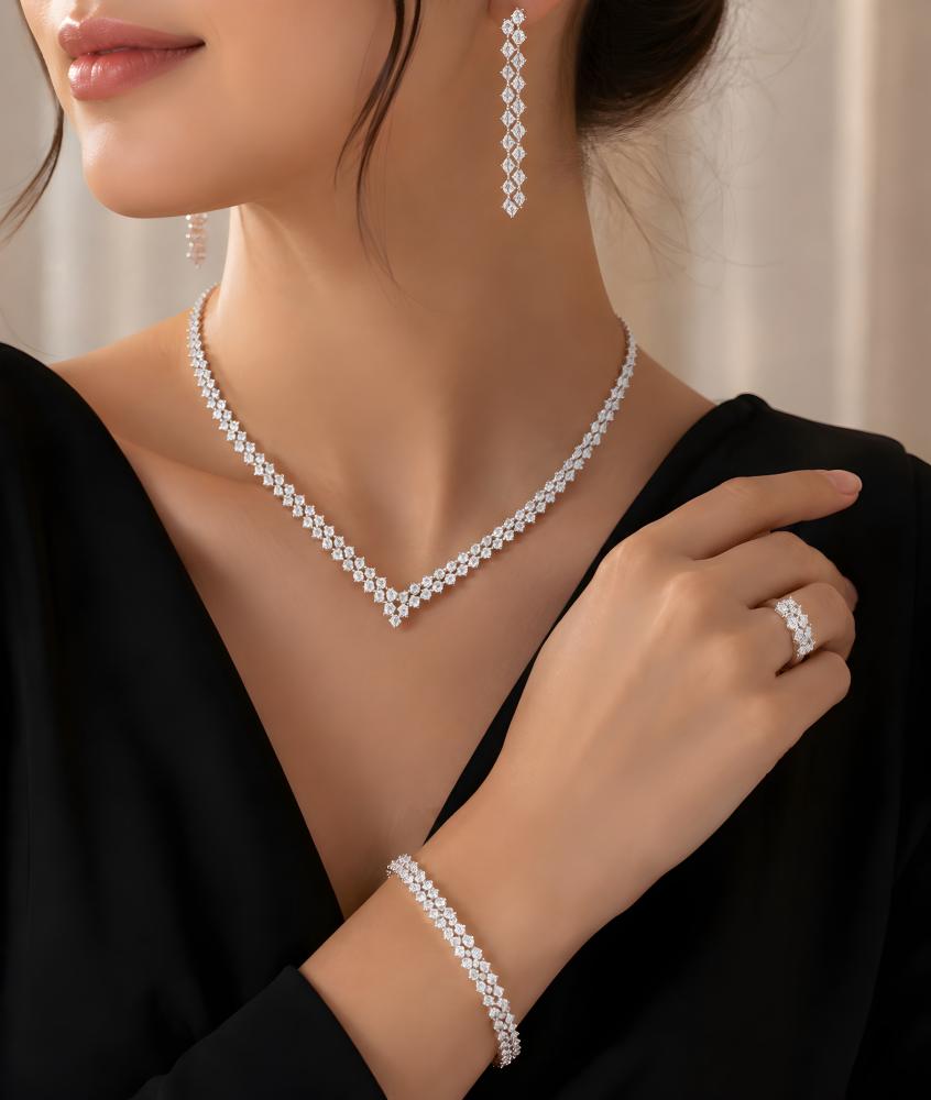 طقم زركون فاخر فضي يضم عقد وسوار وخاتم وأقراط