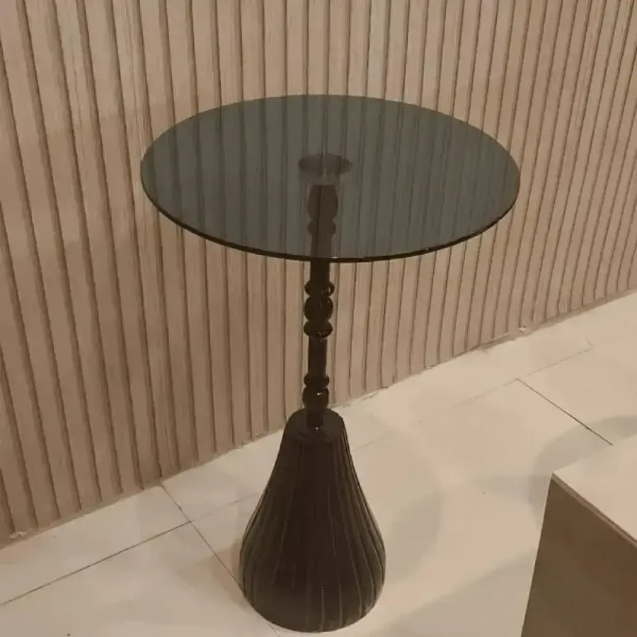 Modern serving table with a steel surface and an artificial marble base