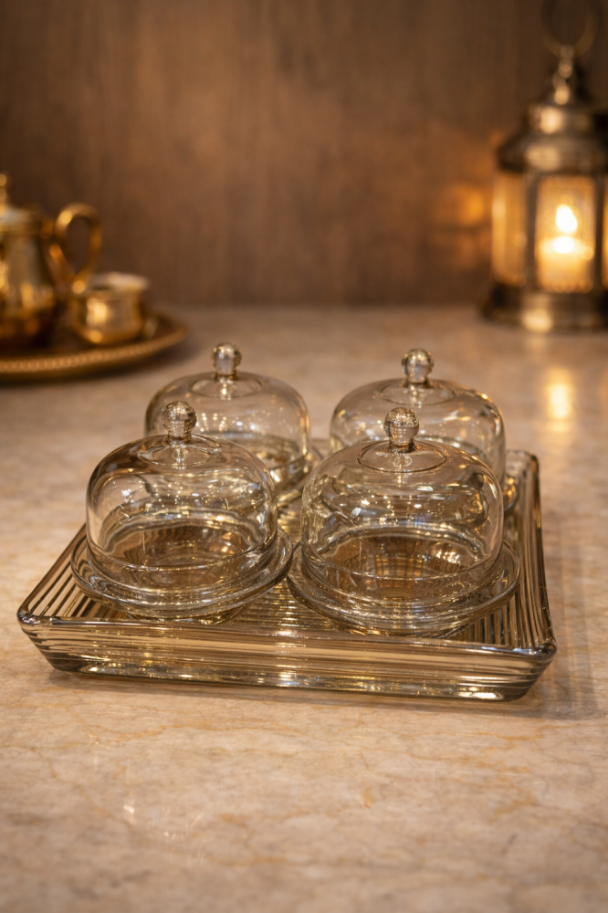 A luxurious glass serving set with an elegant tray