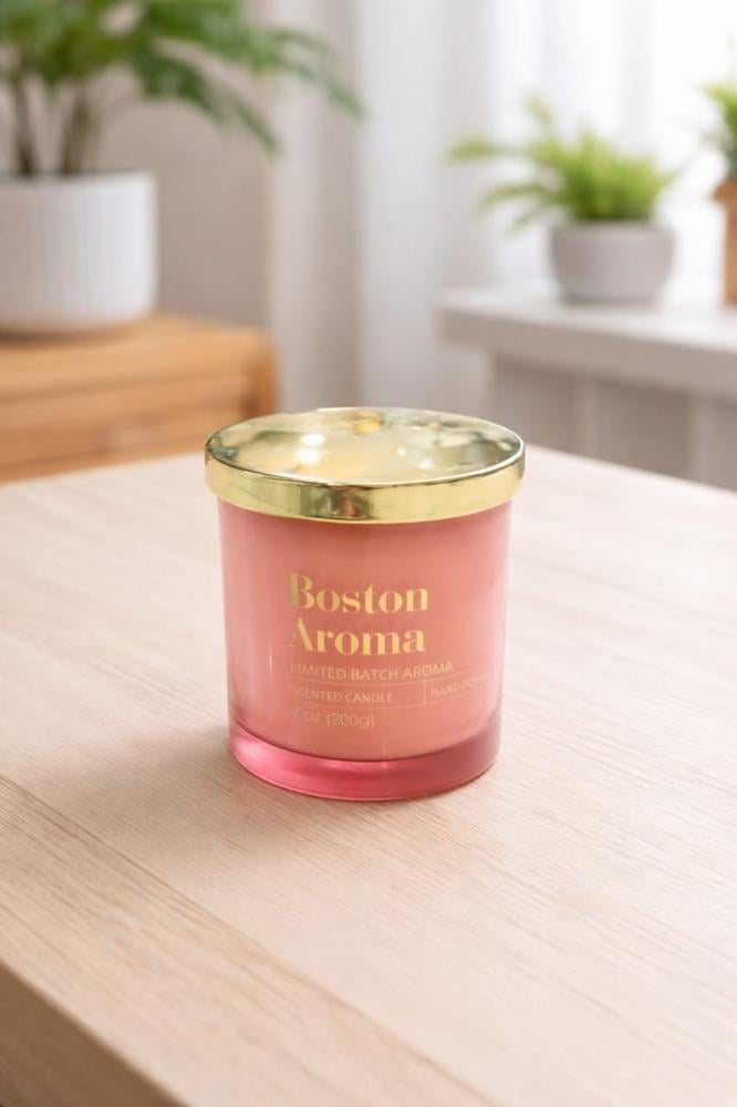 A scented candle with the luxurious pomegranate scent Boston Aroma