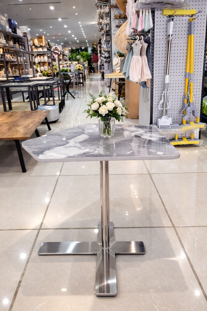 Gray marble serving table with stainless steel base | Difan Al Bakr
