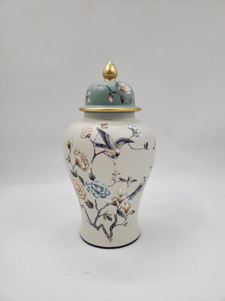 Luxury porcelain vase with green lid and golden details