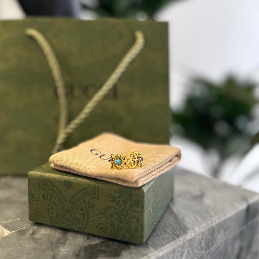 Gold ring with colored flowers