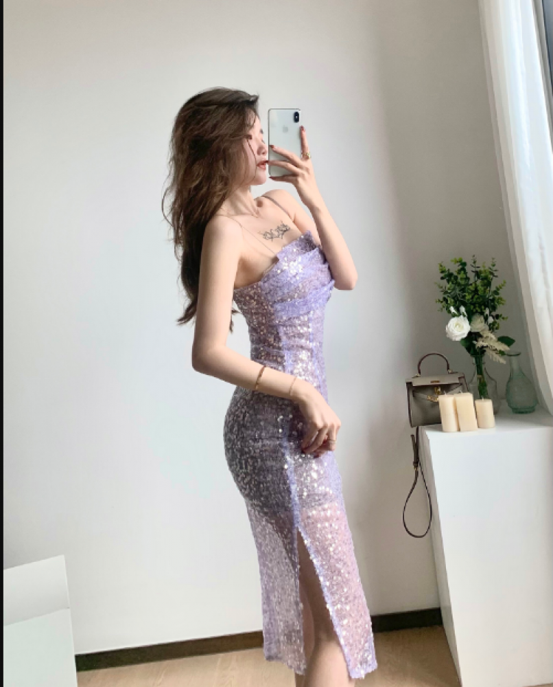A medium-length strap dress with sequins