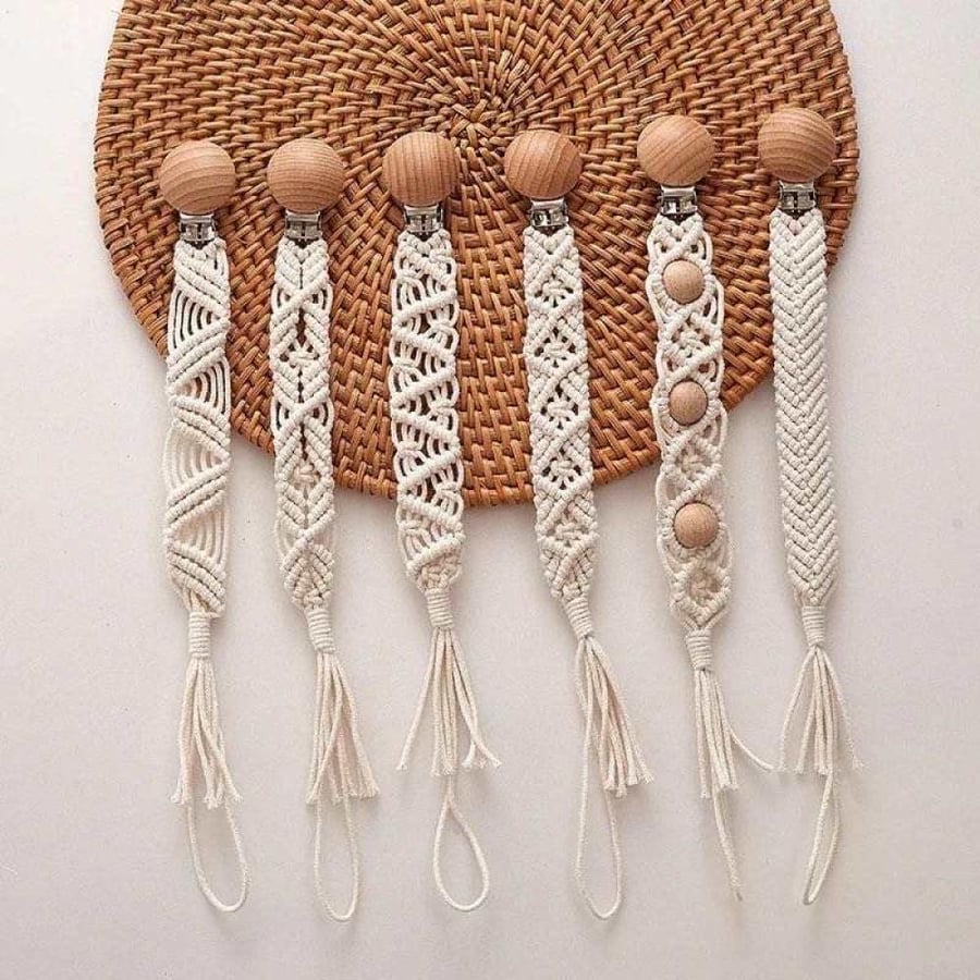 A hanging headband with various shapes in beige color