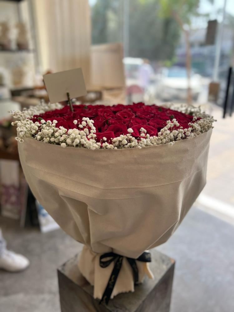 باقة الورد الطبيعي مع القماش