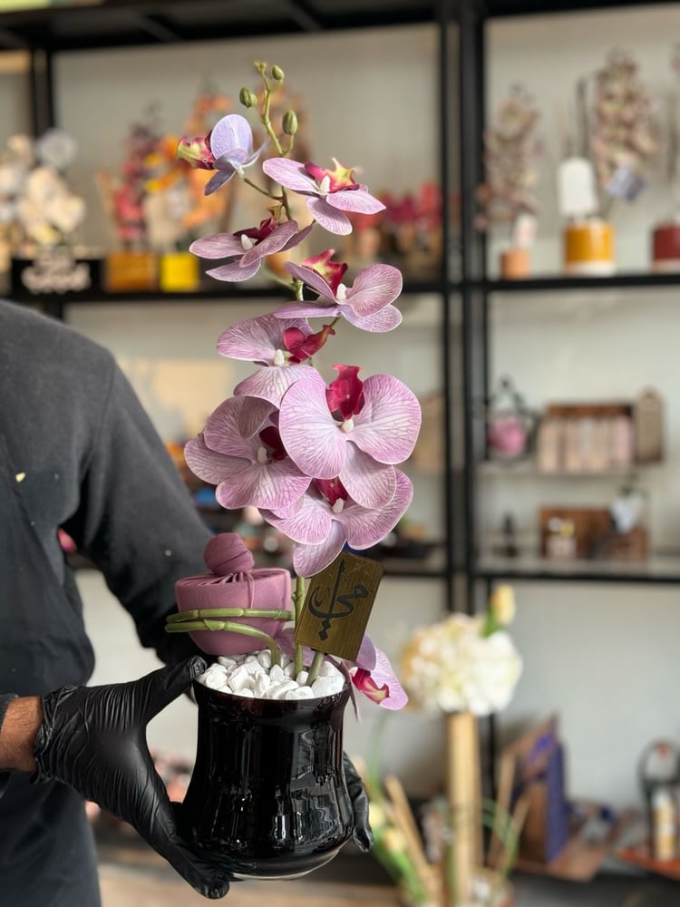Orchid vase with the flowers for Mother's Day