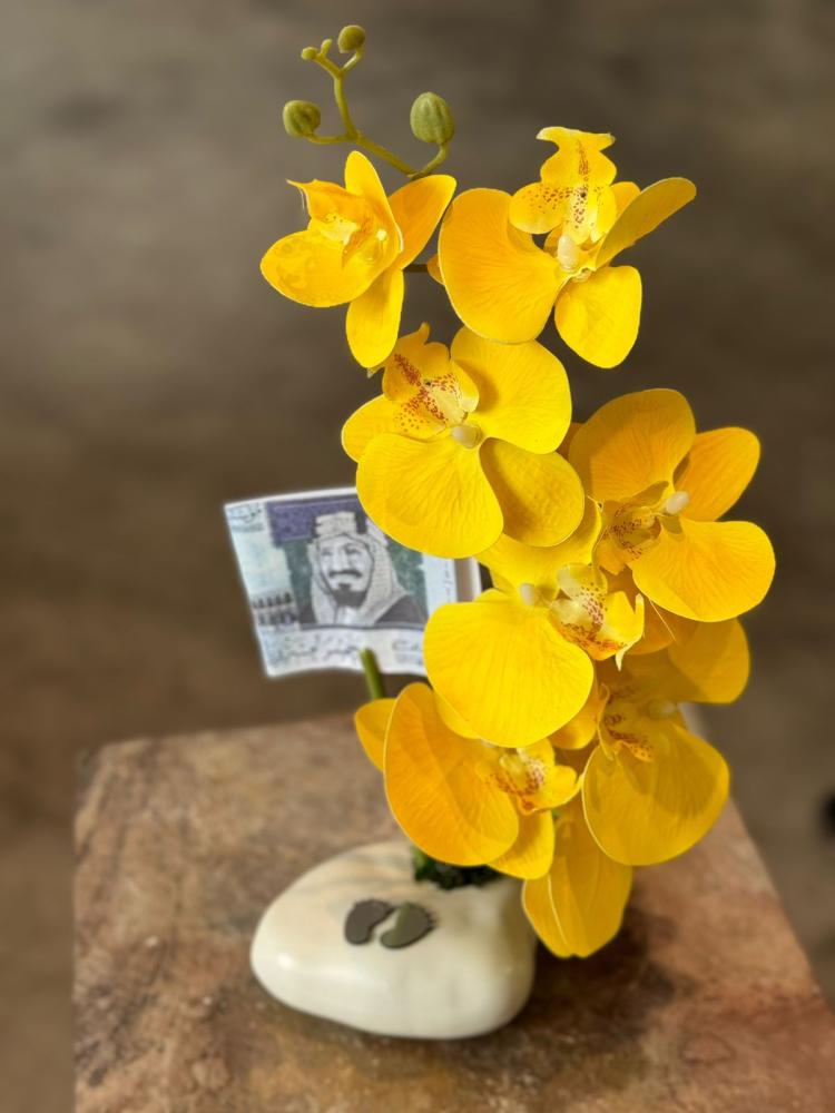 Ceramic vase with orchid
