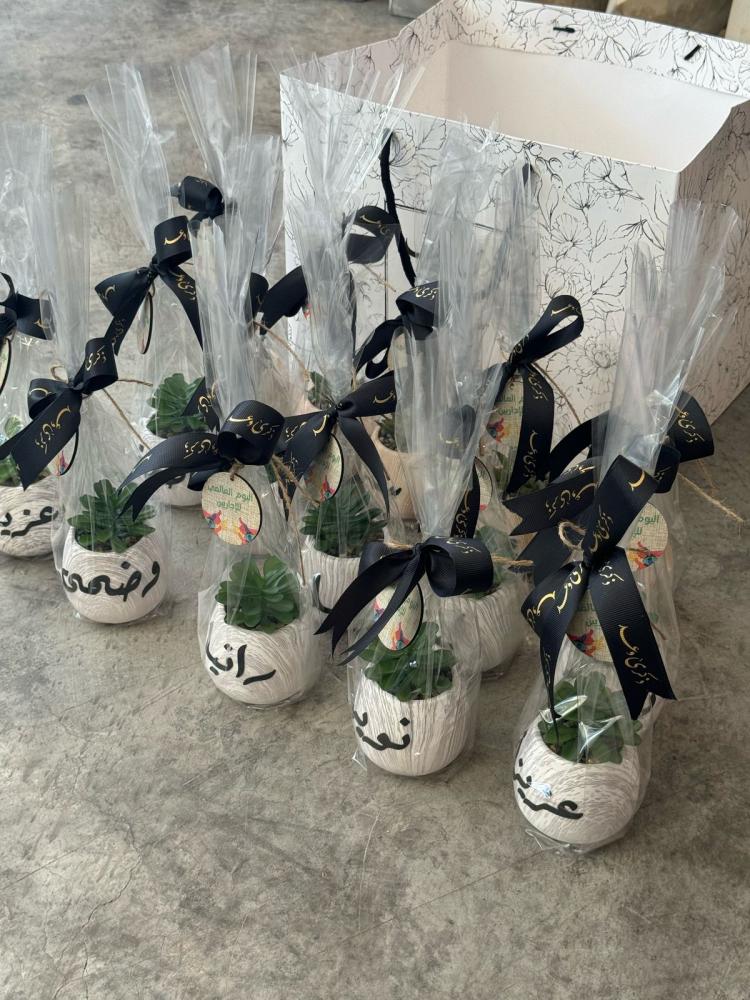 Artificial plant and leather name with logo