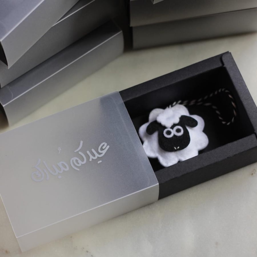 A gift box for Eid with a sheep decoration