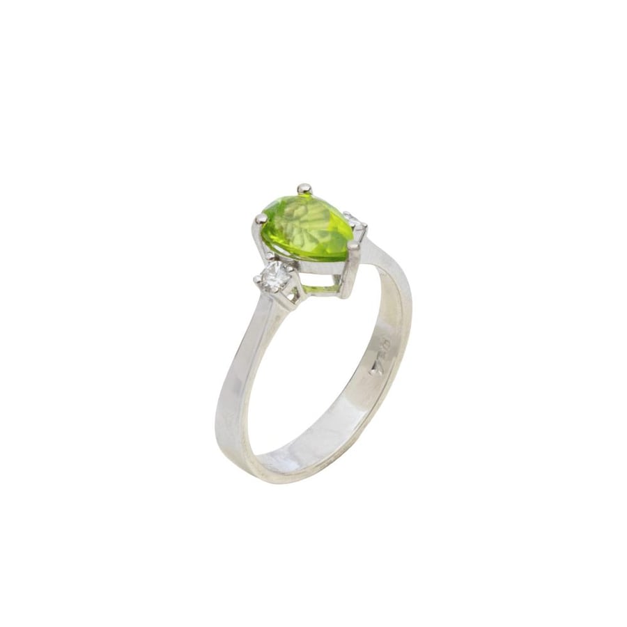 Diamond rings set with round cut diamonds and peridot stone pear cut, designed in white gold