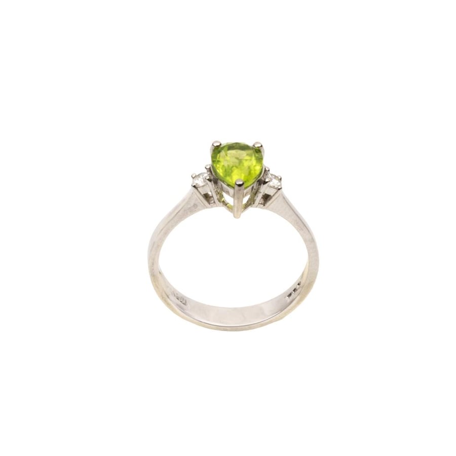Diamond rings set with round cut diamonds and peridot stone pear cut, designed in white gold