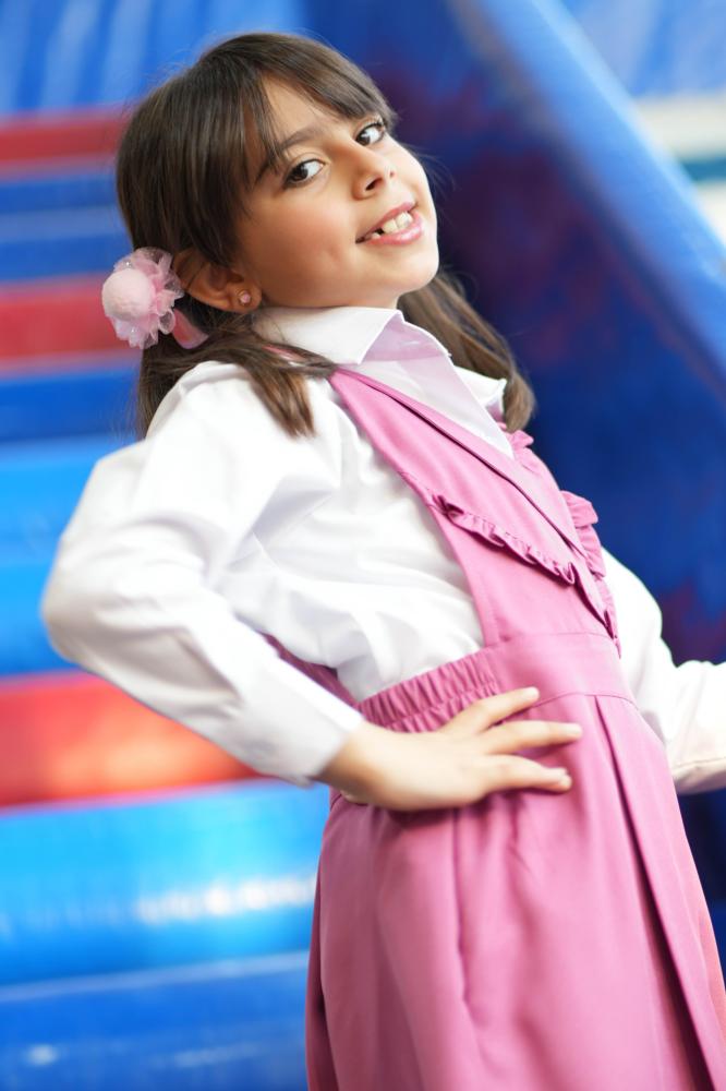 Girls' pink apron set for elementary with a white shirt