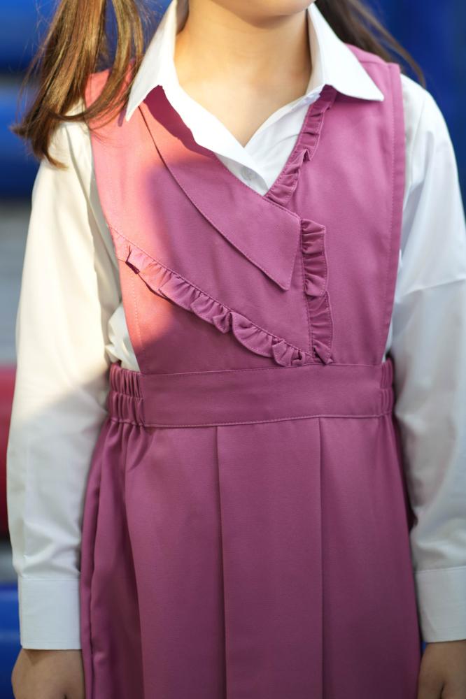 Girls' pink apron set for elementary with a white shirt