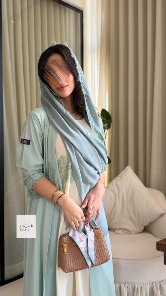 عباية نسيم بقماش كريب احساس مزينه بكلفه مع فستان داخلي سماوي