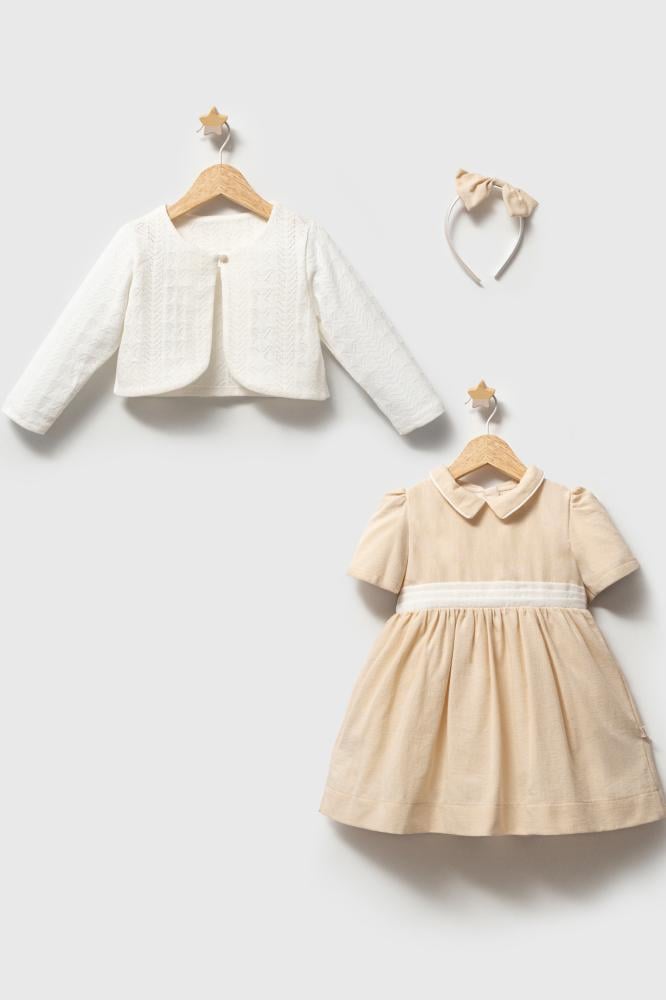 Noor Al-Eid (with a light cotton jacket)