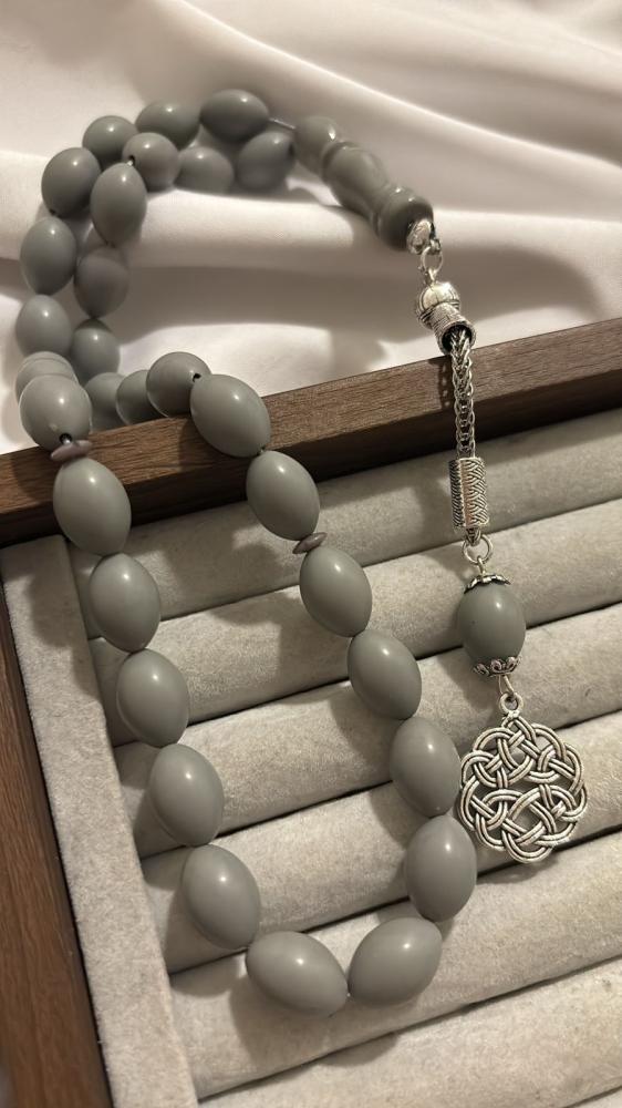 Gray plastic prayer bead string