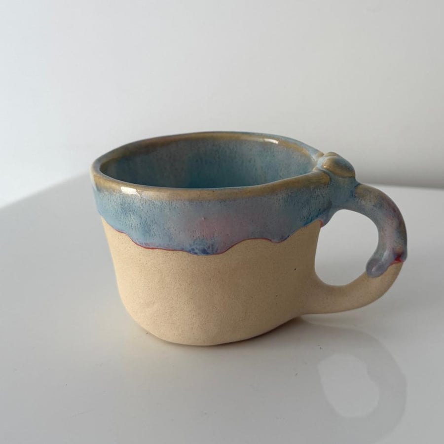 A cup with a poetic phrase