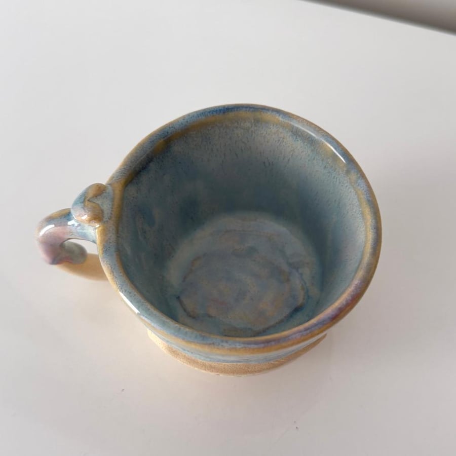 A cup with a poetic phrase