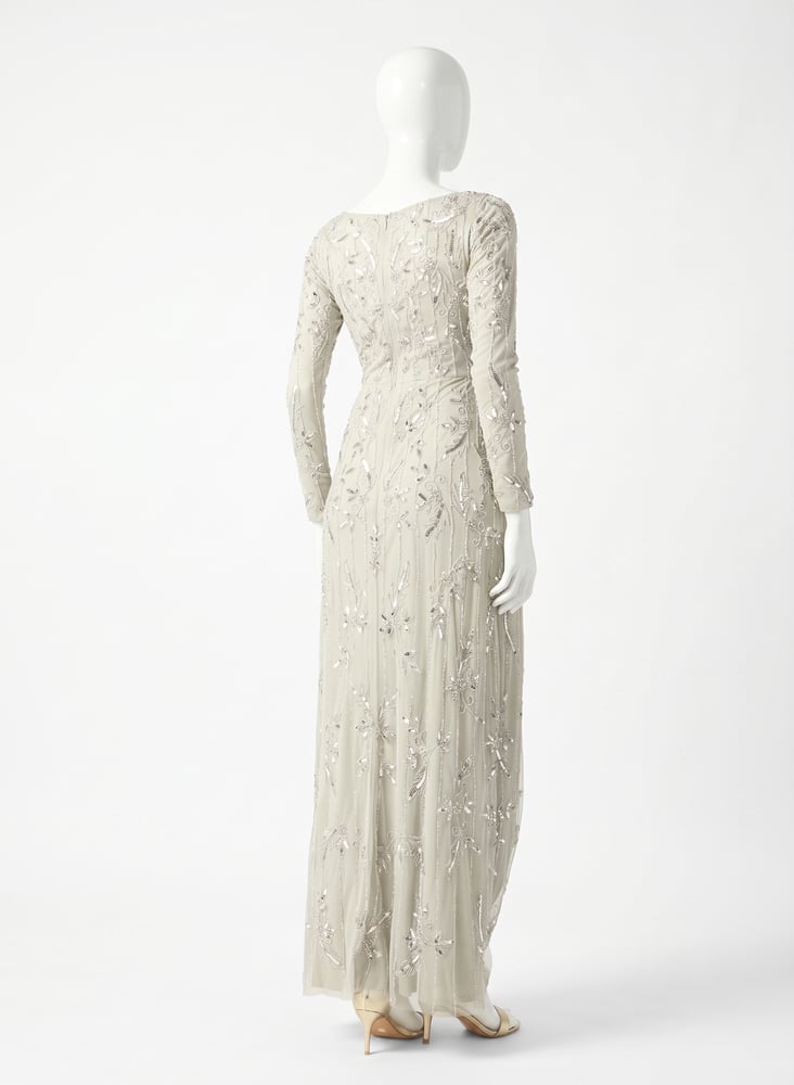 A long maxi dress with long sleeves and a collar in the shape of a letter, decorated with sequins from Anzal.