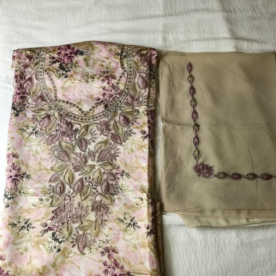 A beige and pink headscarf with a beige and pink headband