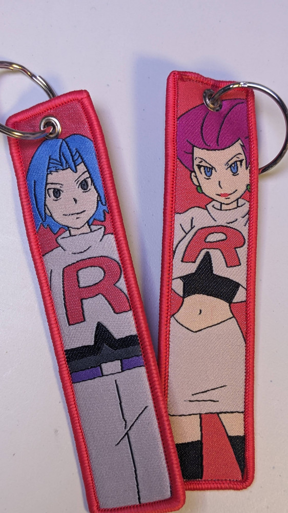 Jacy and James Pokémon medal, different picture for each face.