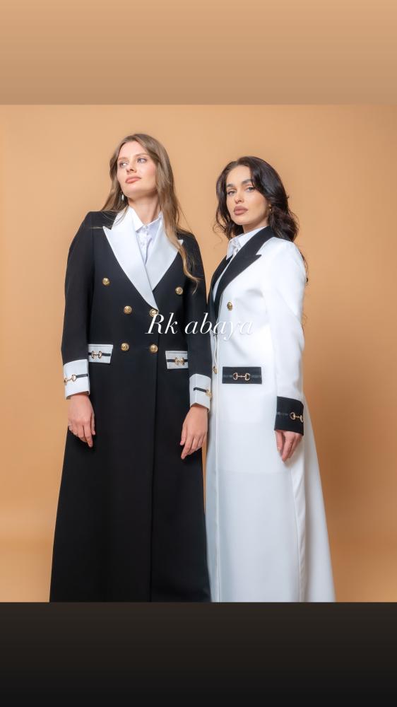Official black blazer and off-white with accessory at cuffs and pockets