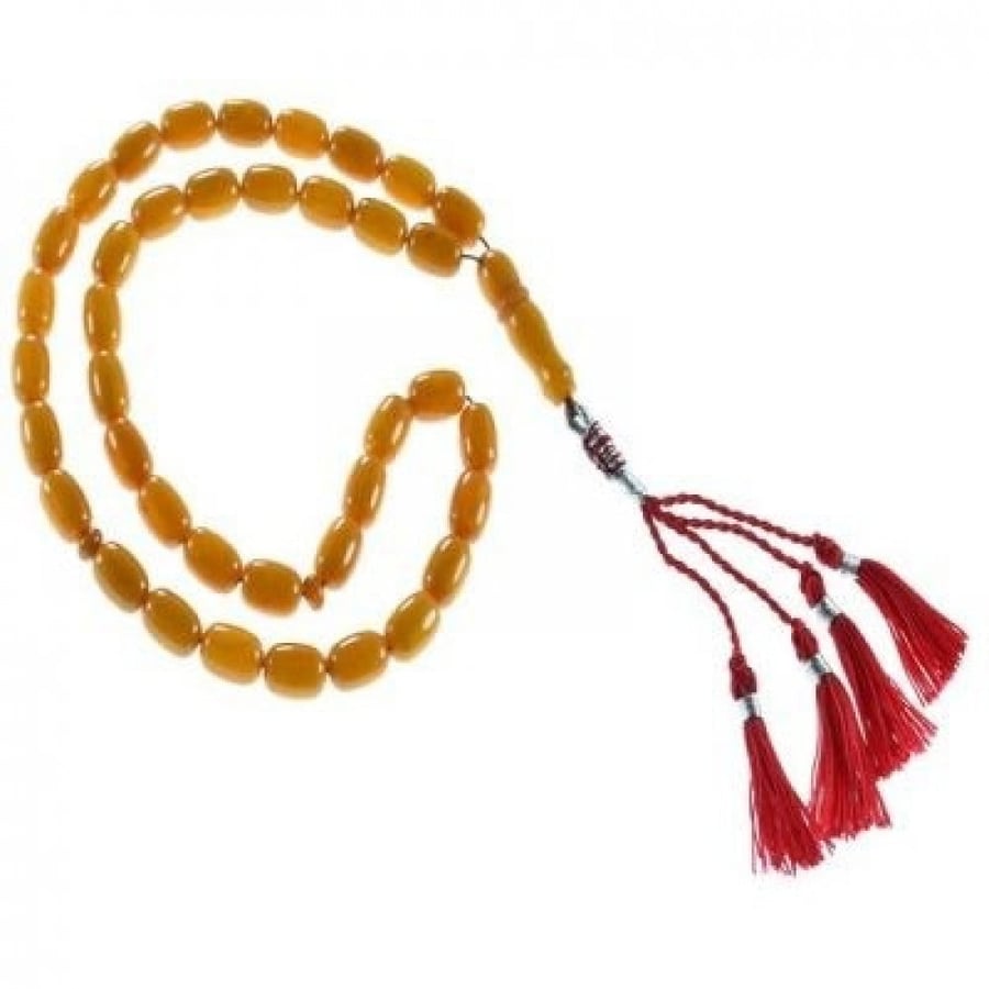 A clay amber oval-shaped prayer bead strand in orange color
