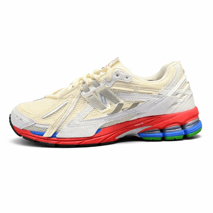 New Balance 1906R – كريمي وأحمر وأزرق