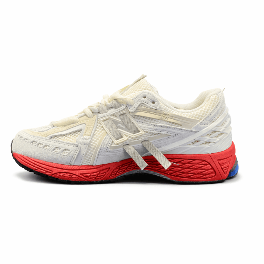 New Balance 1906R – كريمي وأحمر وأزرق