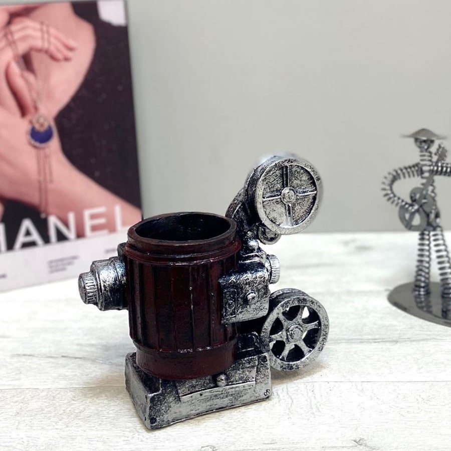 A cinematic camera sculpture ceramic