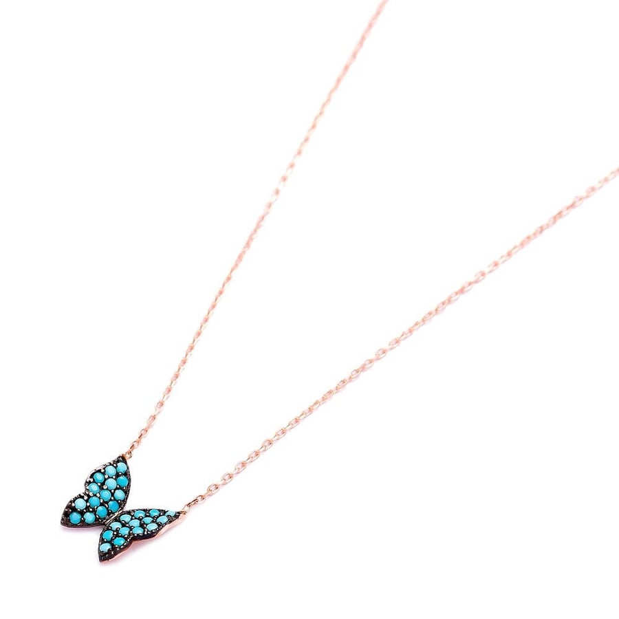 The glowing butterfly pendant encrusted with turquoise zircon stones and plated with pure gold - from Nafis Jewelry Gift Collection, luxury women's gift 1456