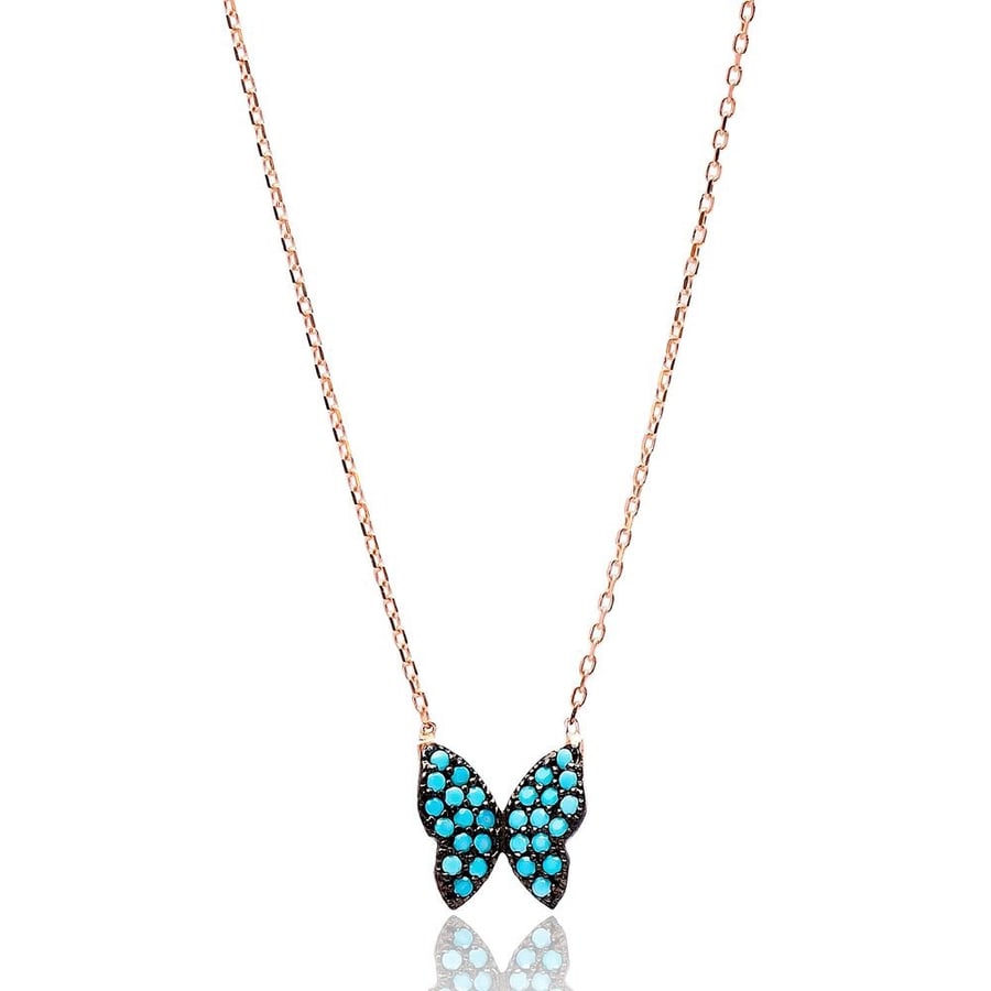 The glowing butterfly pendant encrusted with turquoise zircon stones and plated with pure gold - from Nafis Jewelry Gift Collection, luxury women's gift 1456