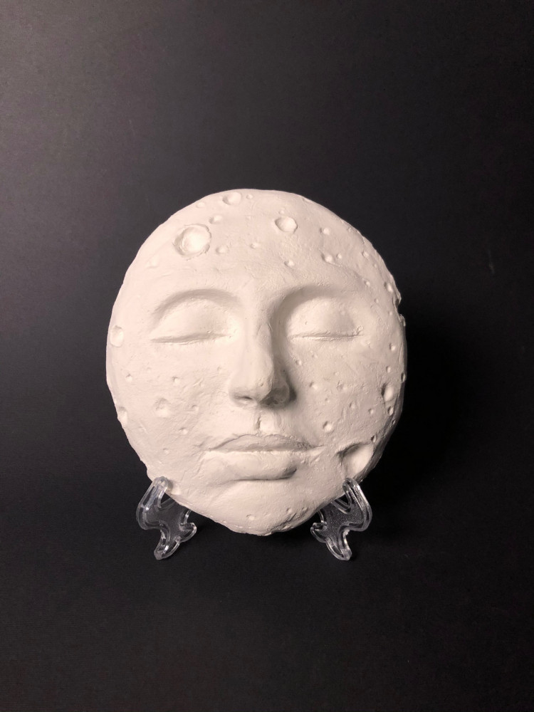 Moon face sculpture