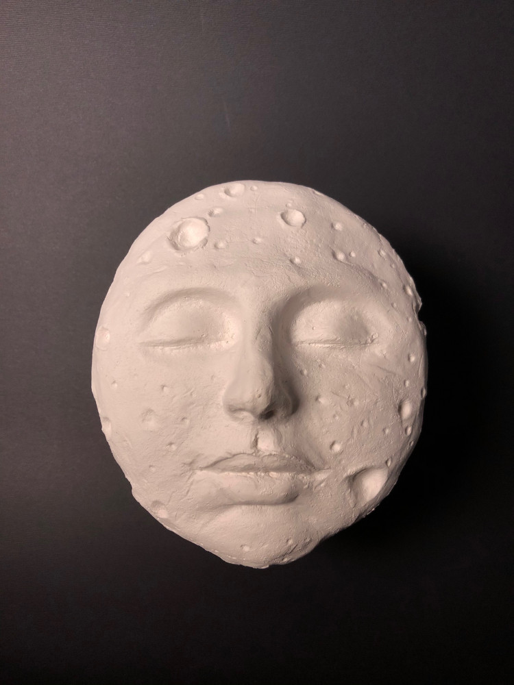 Moon face sculpture