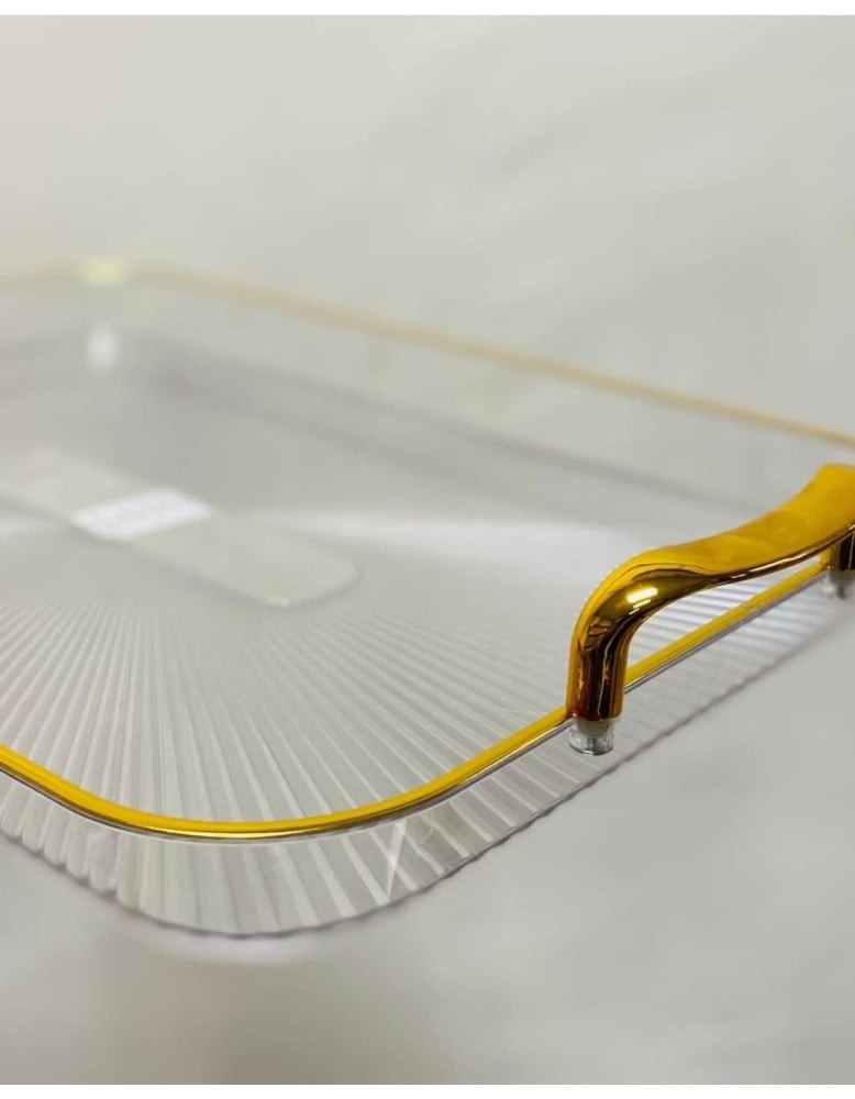 A transparent acrylic Basteen set with a gold handle, consisting of 3 pieces