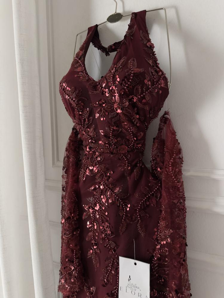 A maroon evening dress with elegant embroidery