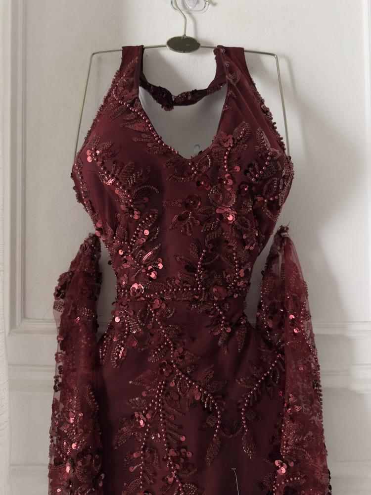 A maroon evening dress with elegant embroidery