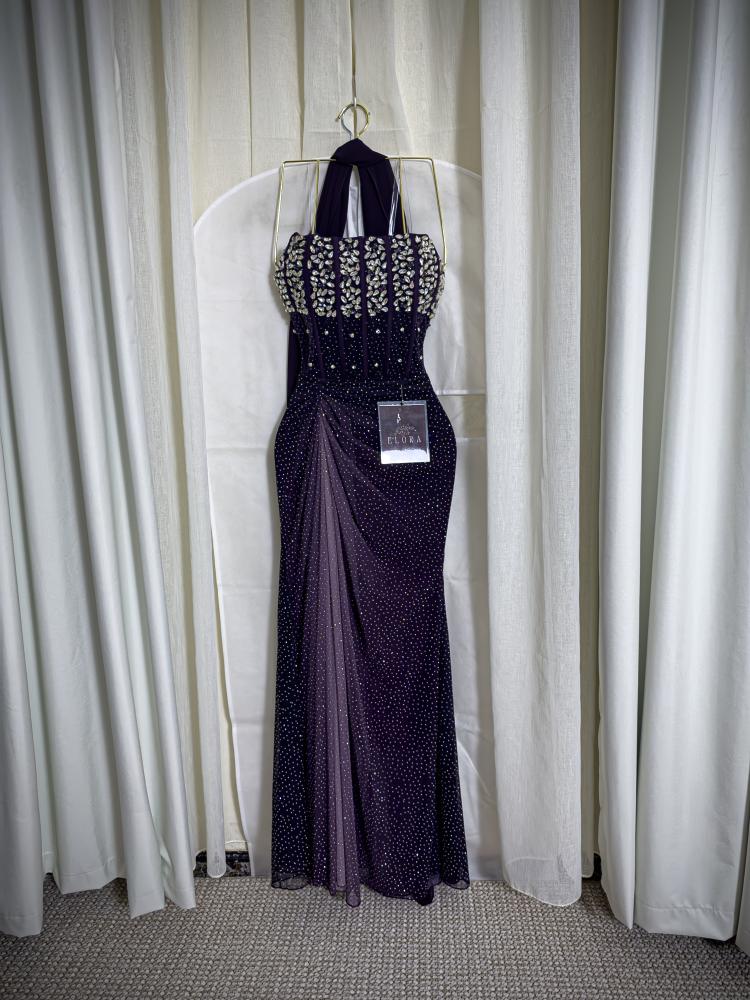 A shiny purple dress with embroidery